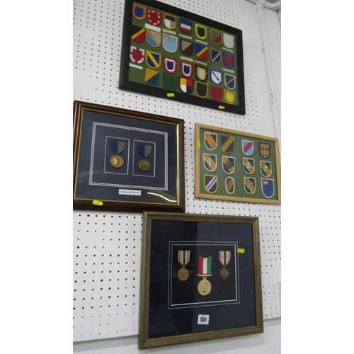 551 - FRAMED MEDALS/BADGES, 2 sets of reproduction medals in frames, together with 2 framed sets of cloth ... 