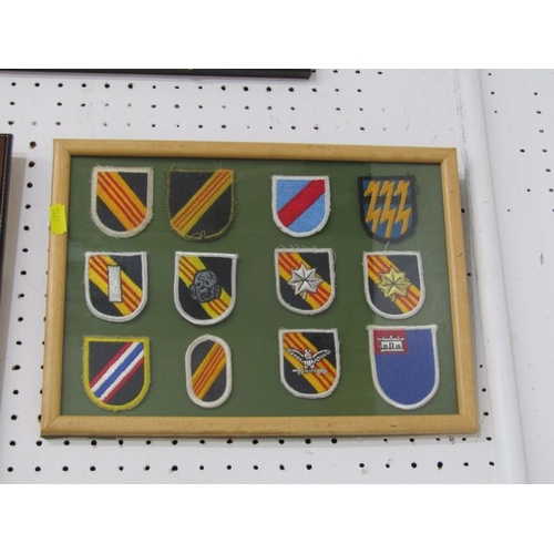 551 - FRAMED MEDALS/BADGES, 2 sets of reproduction medals in frames, together with 2 framed sets of cloth ... 