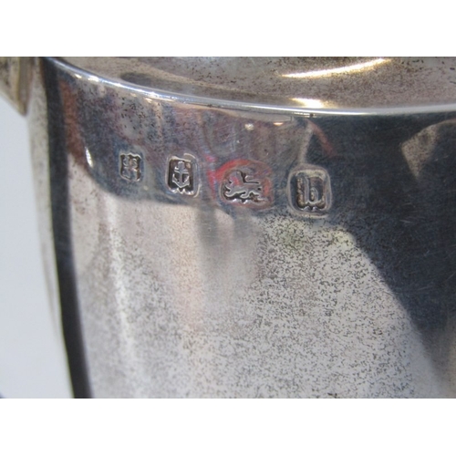 562 - SILVER COFFEE POT, a silver water jug with half fluted design, ebony handle and finial. Birmingham H... 