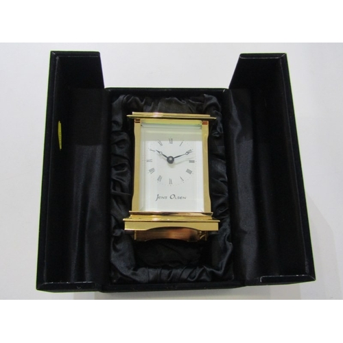 565 - CARRIAGE CLOCK, modern carriage clock with white painted dial by Jens Olsen, together with original ... 