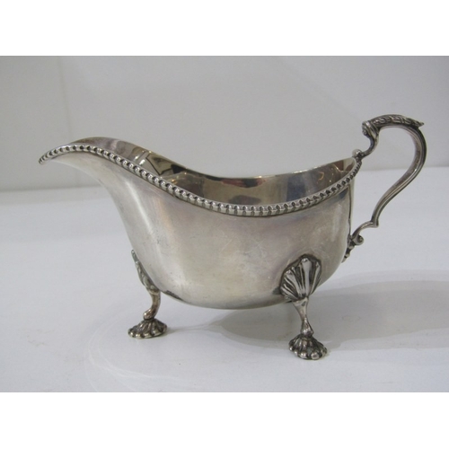 568 - SILVER GRAVY BOAT, silver gravy boat on 3 ornate padded feet, Birmingham HM, 139 grams