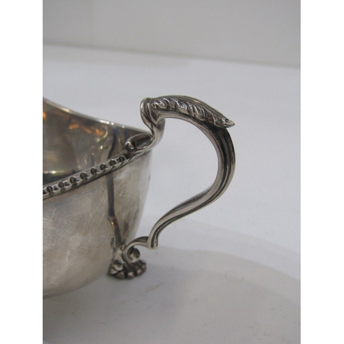 568 - SILVER GRAVY BOAT, silver gravy boat on 3 ornate padded feet, Birmingham HM, 139 grams