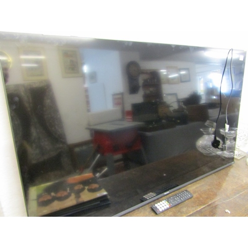 590 - HISENSE TELEVISION, a modern Hisense television with remote control, 111cm width x 65cm height