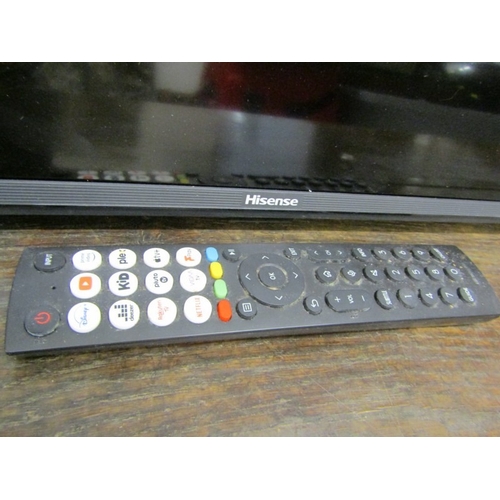 590 - HISENSE TELEVISION, a modern Hisense television with remote control, 111cm width x 65cm height