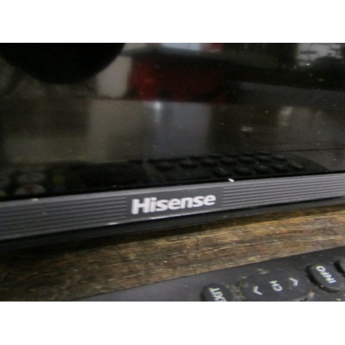 590 - HISENSE TELEVISION, a modern Hisense television with remote control, 111cm width x 65cm height