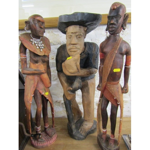 600 - WOOD CARVINGS, 2 native wood carvings, together with a Thoughtful Man and an oil lamp