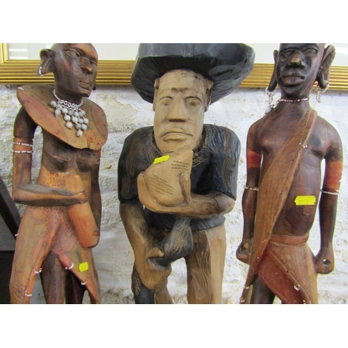 600 - WOOD CARVINGS, 2 native wood carvings, together with a Thoughtful Man and an oil lamp