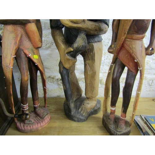 600 - WOOD CARVINGS, 2 native wood carvings, together with a Thoughtful Man and an oil lamp