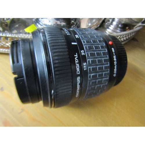 622 - PHOTOGRAPHY, an Olympus OM1 camera, together with a tripod, Canon binoculars, etc