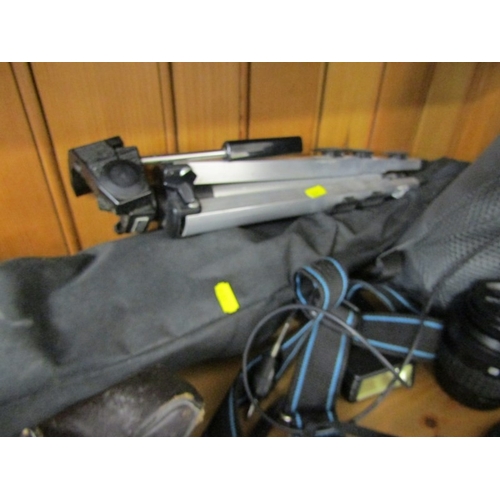 622 - PHOTOGRAPHY, an Olympus OM1 camera, together with a tripod, Canon binoculars, etc