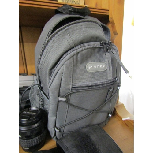 622 - PHOTOGRAPHY, an Olympus OM1 camera, together with a tripod, Canon binoculars, etc