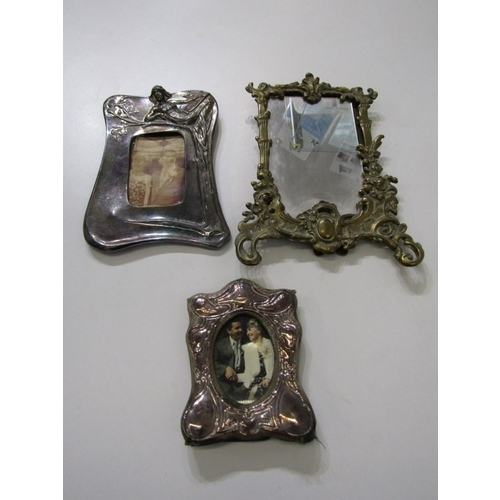 560 - PHOTO FRAMES, a small photo frame with silver mount, together with a brass framed example and an Art... 