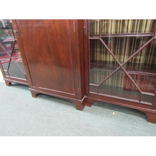 824 - MAHOGANY BREAKFRONT BOOKCASE, with pair of Chippendale design glazed side doors, 138cm height, 184cm... 