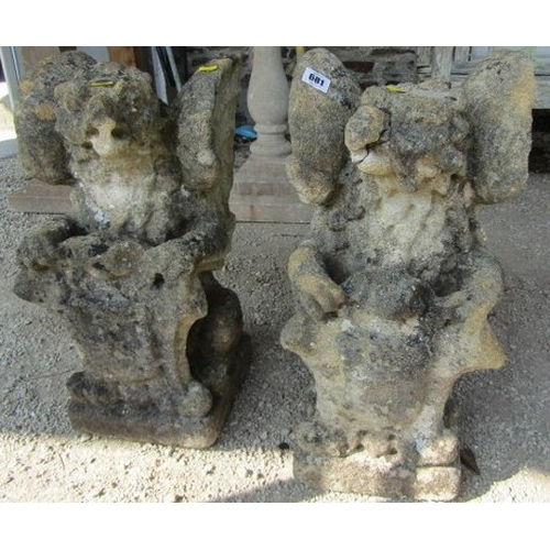 681 - STONEWORK GRIFFINS, pair of stonework griffin finials, 52cm height