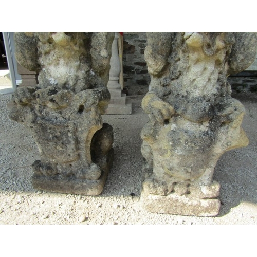 681 - STONEWORK GRIFFINS, pair of stonework griffin finials, 52cm height