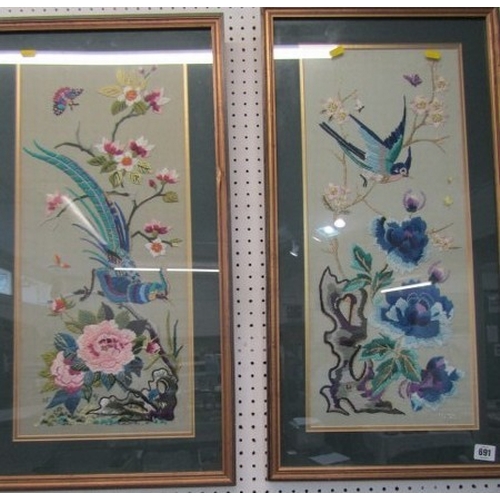 691 - ORIENTAL TAPESTRY, a pair of floral and bird decorated oriental influenced tapestry pictures