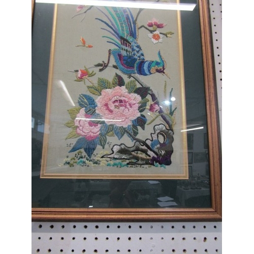 691 - ORIENTAL TAPESTRY, a pair of floral and bird decorated oriental influenced tapestry pictures