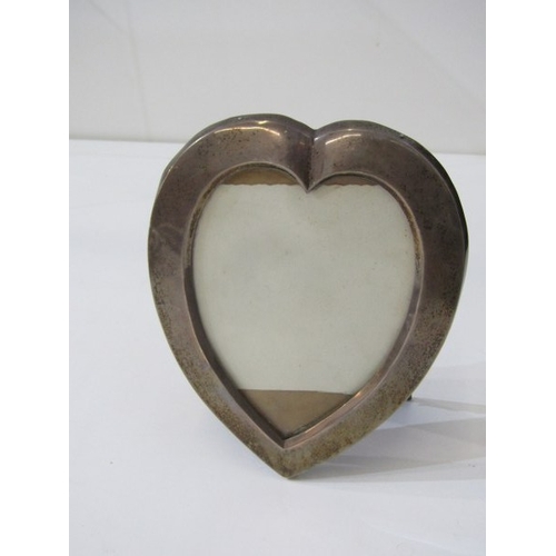695 - SILVER PHOTO FRAME, a heart shaped silver photo frame with repaired easel back, hallmarked London 19... 