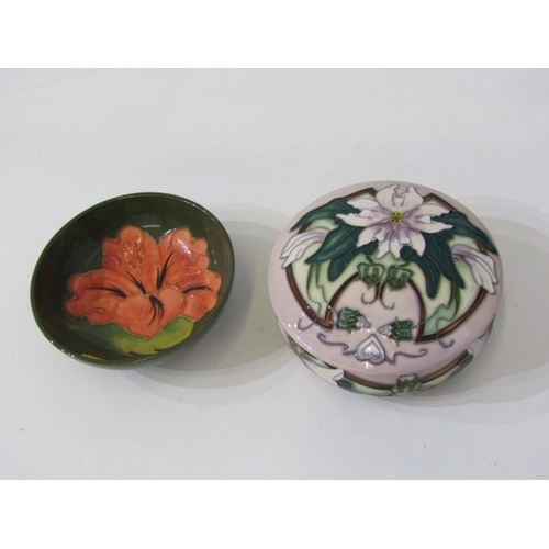 718 - MOORCROFT POTTERY, a Moorcroft trial piece pot and cover, florally decorated together with a green f... 