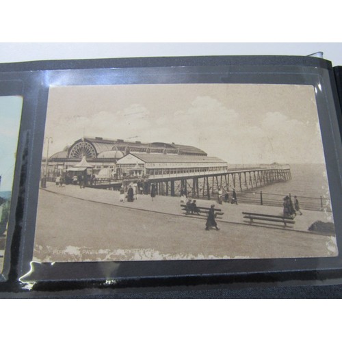 555 - POSTCARDS, a modern collectors album containing a quantity of Edwardian and later; topographical, gr... 