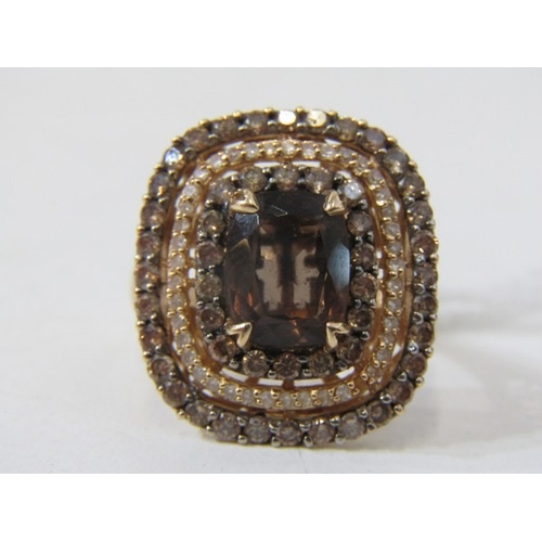 51 - SMOKY QUARTZ RING, 14ct yellow gold ring set an oval smoky quartz in 3 halos of diamonds with a 22mm... 
