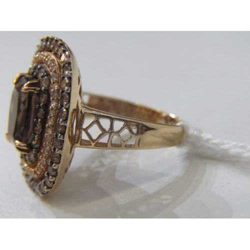 51 - SMOKY QUARTZ RING, 14ct yellow gold ring set an oval smoky quartz in 3 halos of diamonds with a 22mm... 