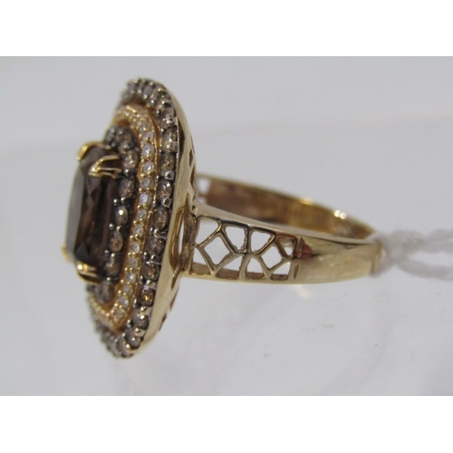 51 - SMOKY QUARTZ RING, 14ct yellow gold ring set an oval smoky quartz in 3 halos of diamonds with a 22mm... 