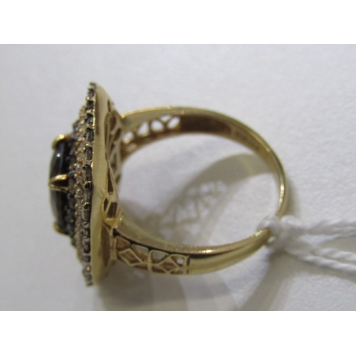 51 - SMOKY QUARTZ RING, 14ct yellow gold ring set an oval smoky quartz in 3 halos of diamonds with a 22mm... 