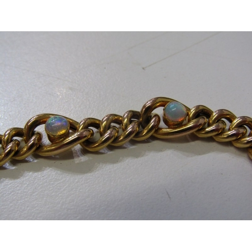 49 - GOLD AND OPAL BRACELET, 9ct yellow gold curb link bracelet with padlock clasp, set with 8 opals, 10.... 