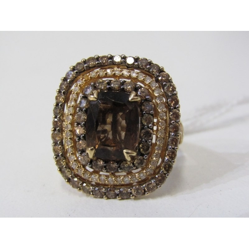 51 - SMOKY QUARTZ RING, 14ct yellow gold ring set an oval smoky quartz in 3 halos of diamonds with a 22mm... 