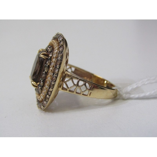 51 - SMOKY QUARTZ RING, 14ct yellow gold ring set an oval smoky quartz in 3 halos of diamonds with a 22mm... 