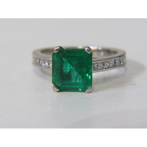 225 - EMERALD & DIAMOND RING, square form, cushion cut emerald, set in platinum with diamonds set around t... 