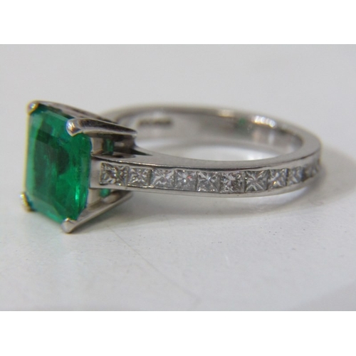 225 - EMERALD & DIAMOND RING, square form, cushion cut emerald, set in platinum with diamonds set around t... 