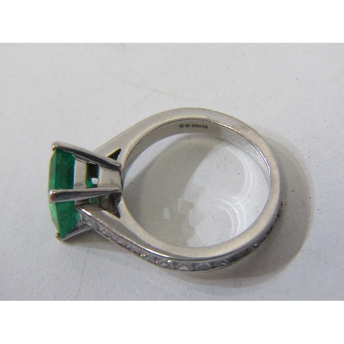 225 - EMERALD & DIAMOND RING, square form, cushion cut emerald, set in platinum with diamonds set around t... 