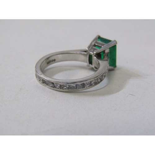 225 - EMERALD & DIAMOND RING, square form, cushion cut emerald, set in platinum with diamonds set around t... 