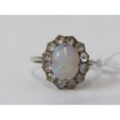 OPAL AND WHITE STONE CLUSTER RING, a white metal ring set with an oval ...