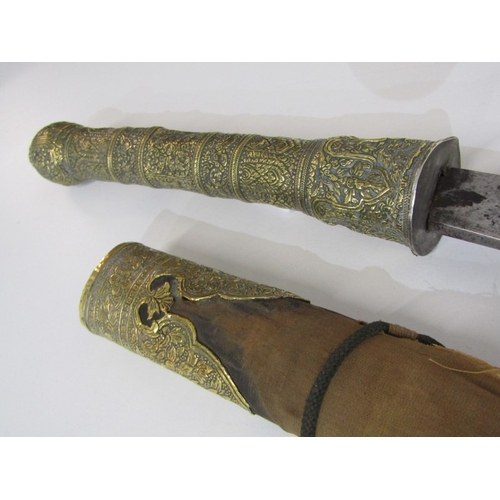 445 - FAR EASTERN SWORD, a far eastern possibly Malaysian sword with ornately decorated brass handle and p... 