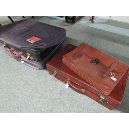 524 - LUGGAGE, An old leather suitcase with leather carrying handle with brass catches and mounts, owners ... 