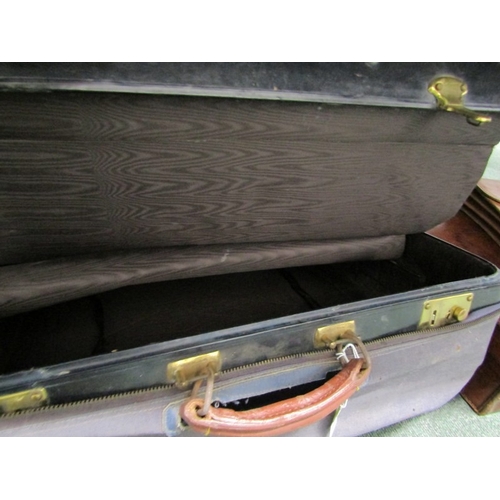 524 - LUGGAGE, An old leather suitcase with leather carrying handle with brass catches and mounts, owners ... 