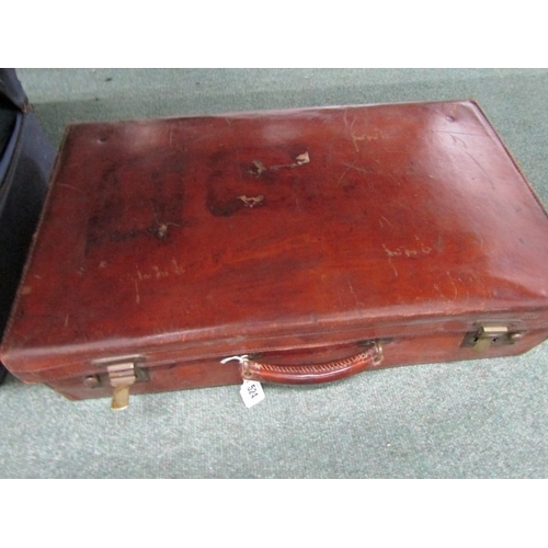 524 - LUGGAGE, An old leather suitcase with leather carrying handle with brass catches and mounts, owners ... 