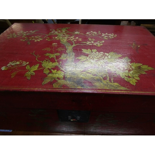 673 - ORIENTAL TRUNK, a Chinese red lacquered trunk, elaborately decorated with birds and flowers, with a ... 