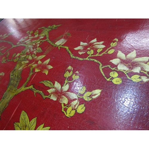 673 - ORIENTAL TRUNK, a Chinese red lacquered trunk, elaborately decorated with birds and flowers, with a ... 