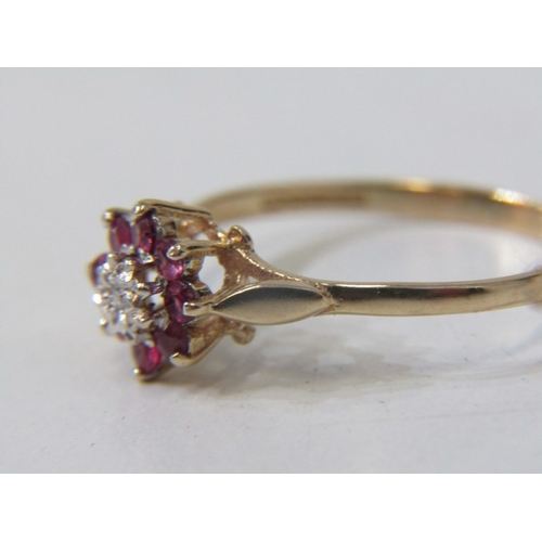 108 - RUBY & DIAMOND CLUSTER RING, 9ct yellow gold ring, set a central diamond surrounded by a cluster of ... 