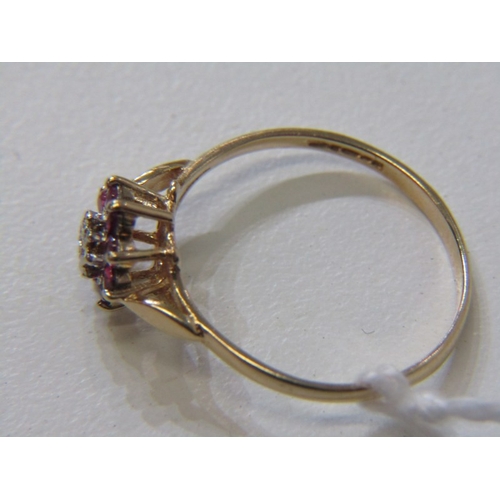 108 - RUBY & DIAMOND CLUSTER RING, 9ct yellow gold ring, set a central diamond surrounded by a cluster of ... 