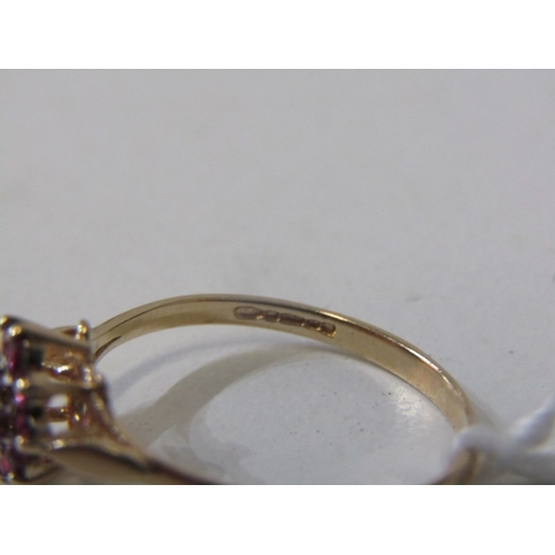 108 - RUBY & DIAMOND CLUSTER RING, 9ct yellow gold ring, set a central diamond surrounded by a cluster of ... 