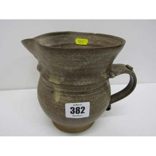 91 - STUDIO POTTERY, a studio pottery jug with light and medium brown glaze, twist handle (chip), 15cm he... 