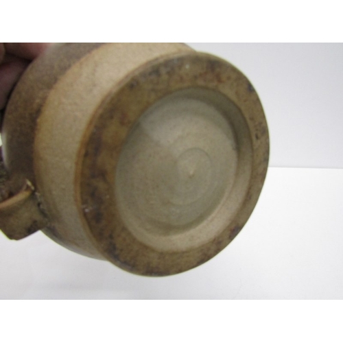 91 - STUDIO POTTERY, a studio pottery jug with light and medium brown glaze, twist handle (chip), 15cm he... 