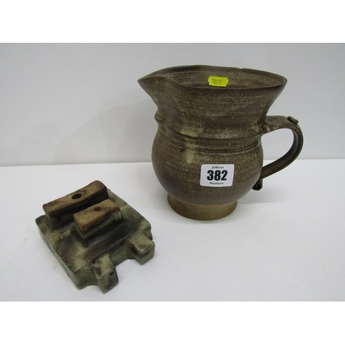91 - STUDIO POTTERY, a studio pottery jug with light and medium brown glaze, twist handle (chip), 15cm he... 