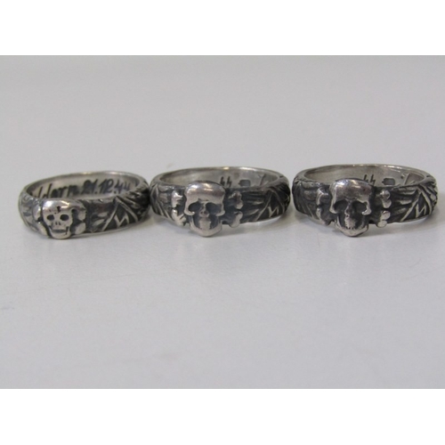 113 - 3 GERMAN MILITARY RINGS, 3 Nazi style silver rings decorated with skulls and crossbones, various siz... 