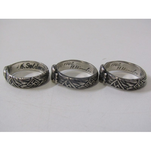 113 - 3 GERMAN MILITARY RINGS, 3 Nazi style silver rings decorated with skulls and crossbones, various siz... 